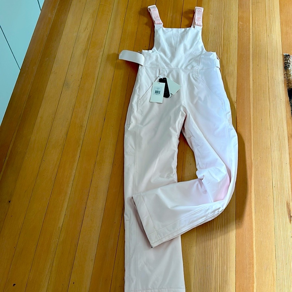 Half days Carson Bib Snowpant. New with Tags, never worn.